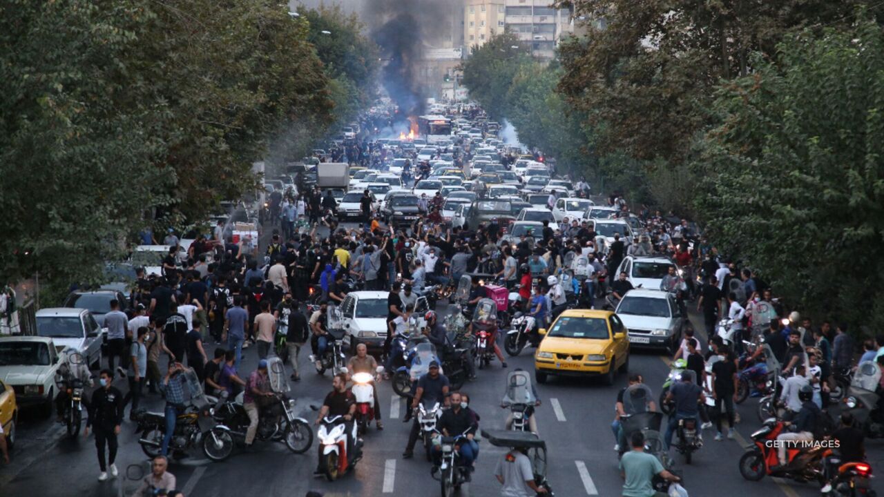 President Biden told supporters "we're going to free Iran" while at a campaign stop. Global protests against Iran's ruling regime continue.