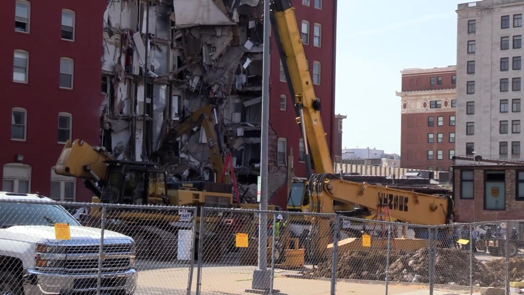 Crews used heavy machinery as the recovery process continued at the Davenport Hotel.