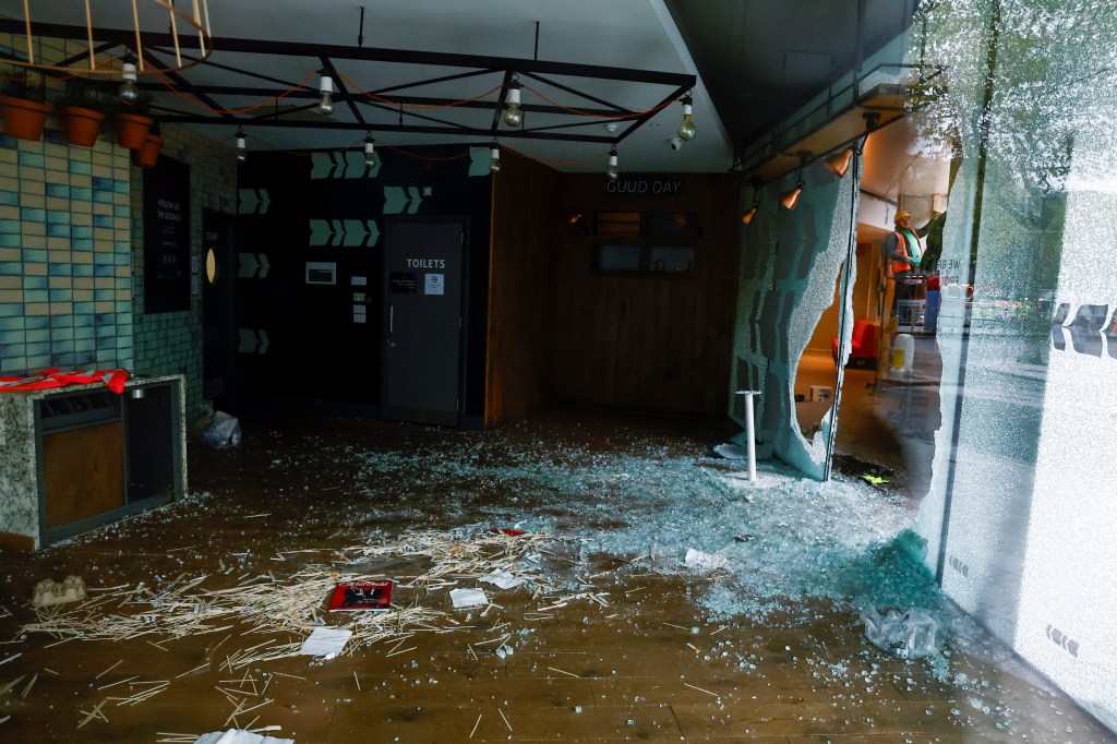 Shattered glass lies on the floor inside a Holiday Inn hotel that was damaged in a riot, in the aftermath of a school stabbing that left several children and adults injured, in Dublin, Ireland November 24, 2023. REUTERS/Clodagh Kilcoyne