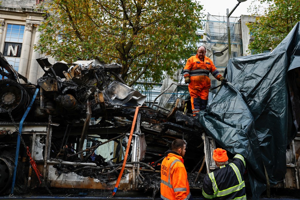 Workers cover up wreckage, following a riot in the aftermath of a school stabbing that left several children and adults injured, in Dublin, Ireland November 24, 2023. REUTERS/Clodagh Kilcoyne