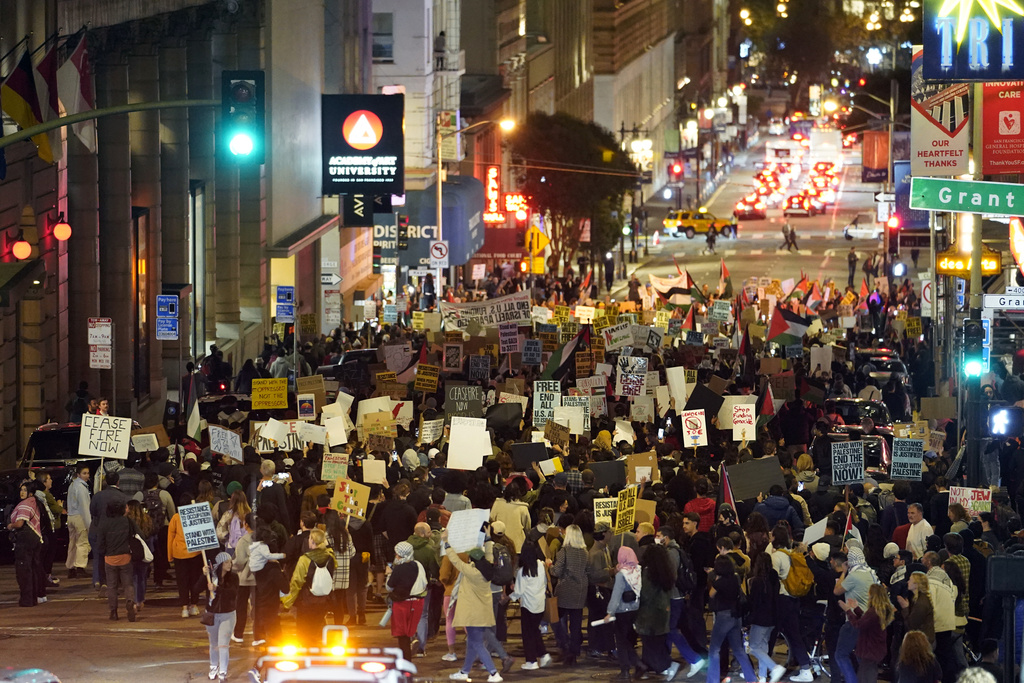 Demonstrators march in opposition to the Israel-Hamas war in conjunction with the APEC Summit taking place Tuesday, Nov. 14, 2023, in San Francisco. (AP Photo/Godofredo A. Vásquez)