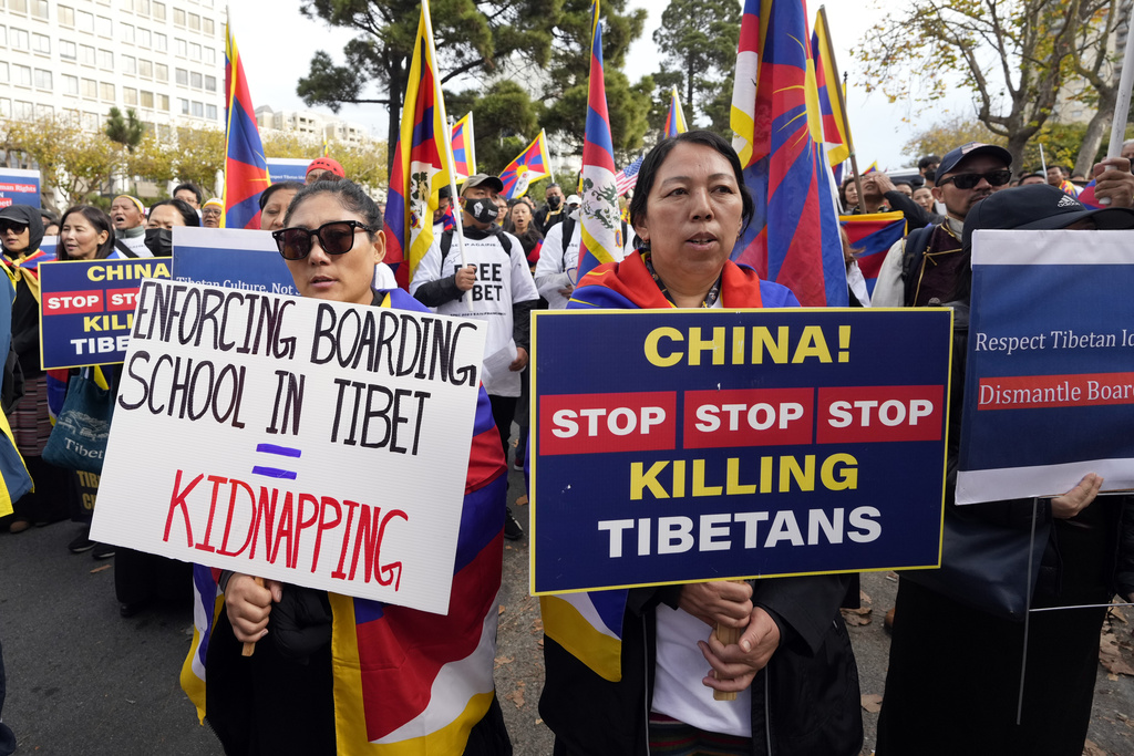 Demonstrators gather outside of the Chinese Consulate to protest the participation in the APEC Summit of Chinese President Xi Jinping Wednesday, Nov. 15, 2023, in San Francisco. (AP Photo/Tony Avelar)