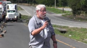 Two people died when a gunman opened fire during an environmental protest. Kenneth Darlington, a U.S. citizen born in Panama, was arrested.