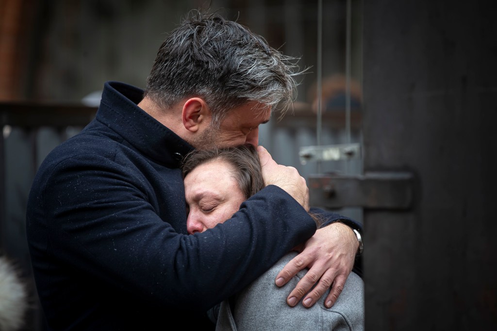 PRAGUE, CZECH REPUBLIC - DECEMBER 22: People mourn outside the Charles University building following a mass shooting yesterday, on December 22, 2023 in Prague, Czech Republic. Fourteen people were killed and 25 injured in the university shooting on Thursday December 21st in central Prague, with police confirming the gunman dead after a mass shooting took place. Police say the gunman was a 24-year-old student at the university.  (Photo by Gabriel Kuchta/Getty Images)