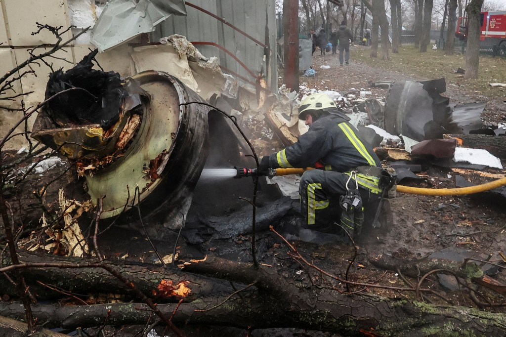 A firefighter extinguishes remains of an unidentified missile, which Ukrainian authorities claimed to be made in North Korea, at a site of a Russian strike, amid Russia's attack on Ukraine, in Kharkiv, Ukraine January 2, 2024. REUTERS/Vyacheslav Madiyevskyy