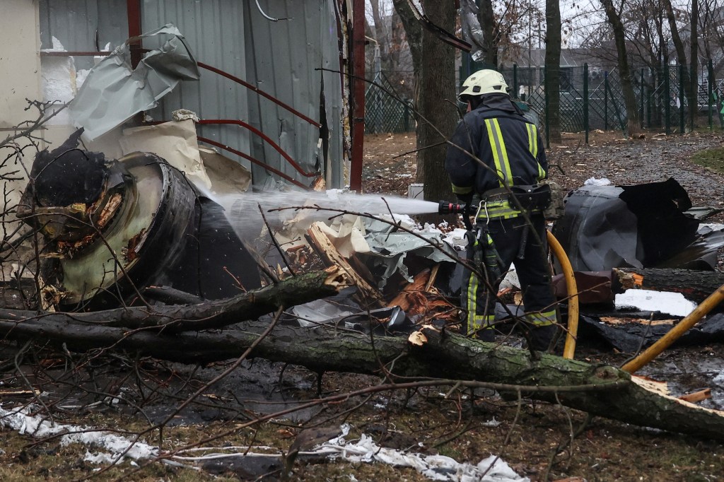 A firefighter extinguishes remains of an unidentified missile, which Ukrainian authorities claimed to be made in North Korea, at a site of a Russian strike, amid Russia's attack on Ukraine, in Kharkiv, Ukraine January 2, 2024. REUTERS/Vyacheslav Madiyevskyy