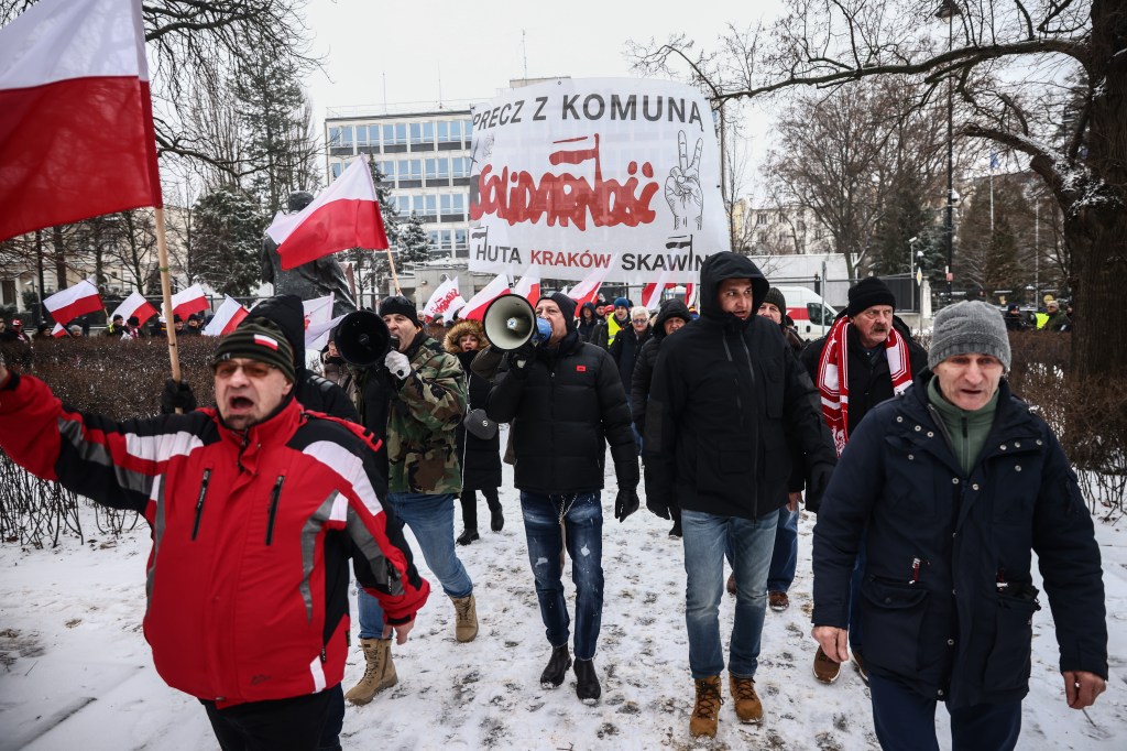 People supporting right-wing opposition Law and Justice party attend 'Free Poles Protest' in front of parliament building in Warsaw, Poland on January 11, 2024. The previous government called people to demonstrate against new pro-EU government which dismissed executives from state media which served the right-wing Law and Justice Party during its eight years in power. Protestors also demonstrated against the arrest of Mariusz Kaminski and Maciej Wasik, lawmakers for Law and Justice (PiS) party, sentenced to two years in prison for abuse of power in 2007, when they were in charge of the anti-corruption agency CBA. (Photo by Beata Zawrzel/NurPhoto)NO USE FRANCE