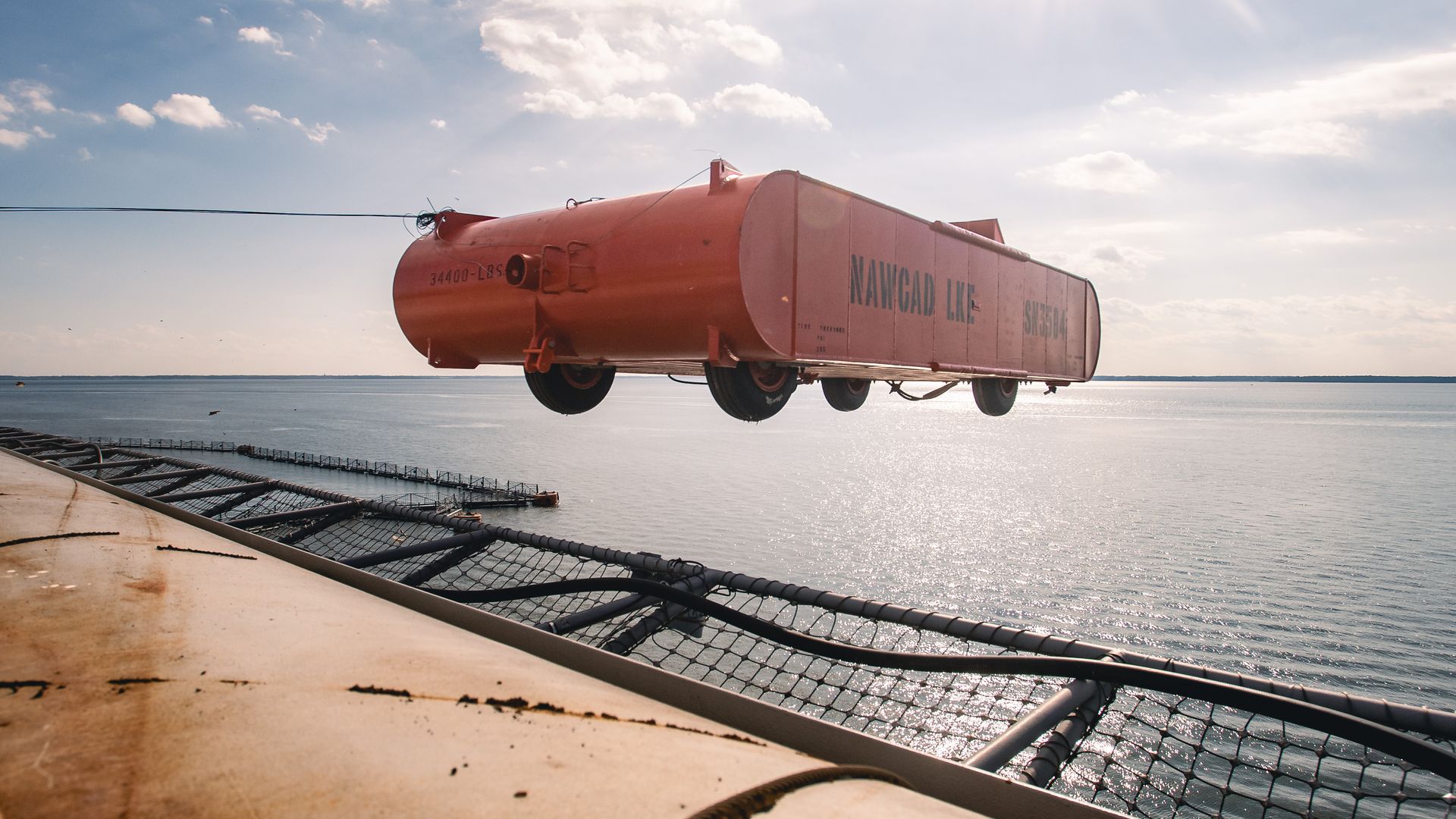 The U.S. Navy newest carrier is throwing large metal carts into the River. It’s okay, though. It’s all part of the process.