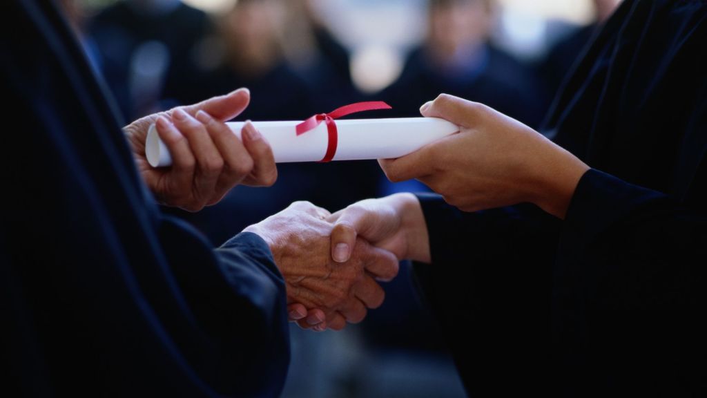 Video from a high school graduation shows a parent pushing away a superintendent before he can shake hands with his daughter.