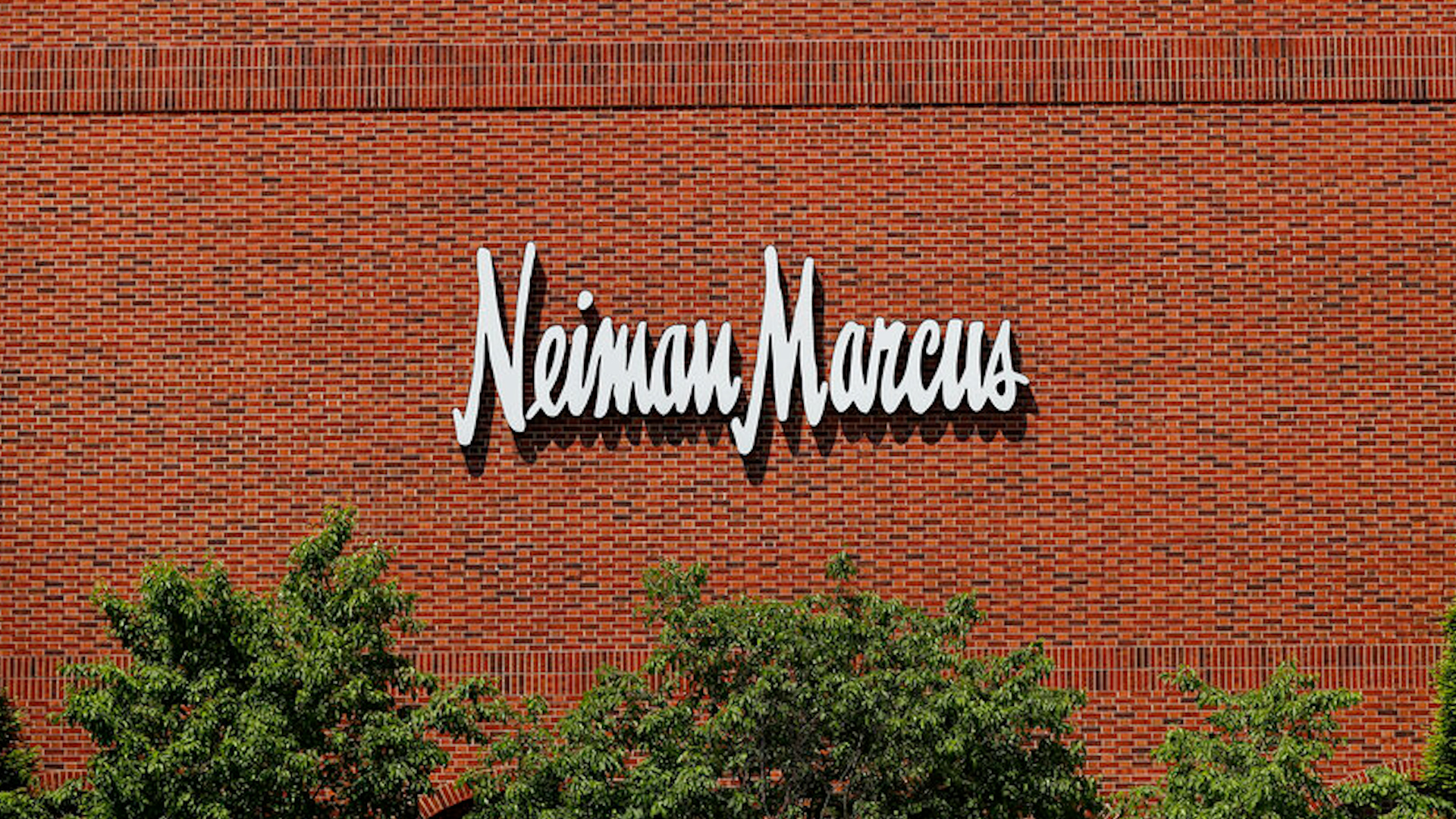 Saks Fifth Avenue's parent company acquires Neiman Marcus for .65 billion, forming Saks Global to boost luxury retail power.