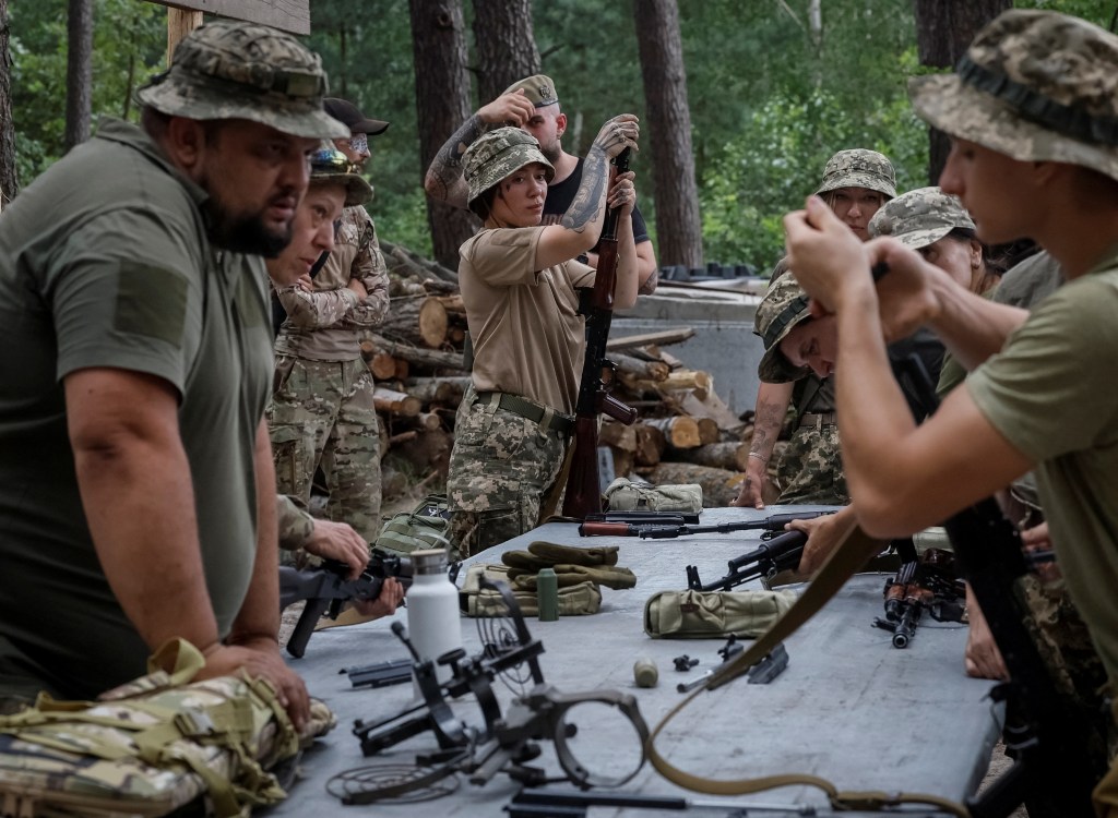 Members of the female anti-drone mobile air defence unit "Bucha Witches" from military Volunteer formation of Bucha territorial community, train to disassemble assault rifles, amid Russia's attack on Ukraine, during exercises near the town of Bucha in Kyiv region, Ukraine August 3, 2024. REUTERS/Gleb Garanich