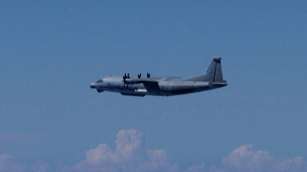 Japanese officials confirm a Chinese military aircraft breached Japanese airspace, escalating tensions in the region.