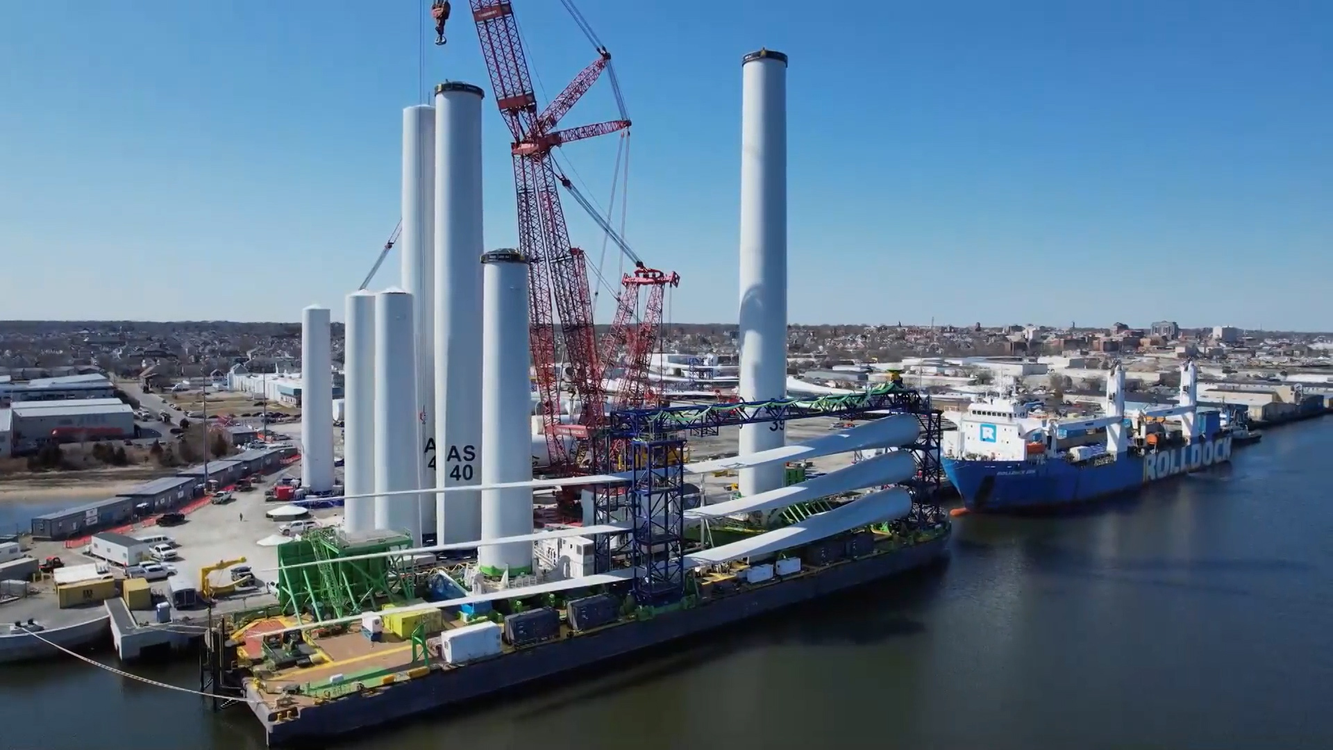 Construction is back on at an offshore wind farm that sent debris onto nearby beaches as concerns are raised over its effect on whales.