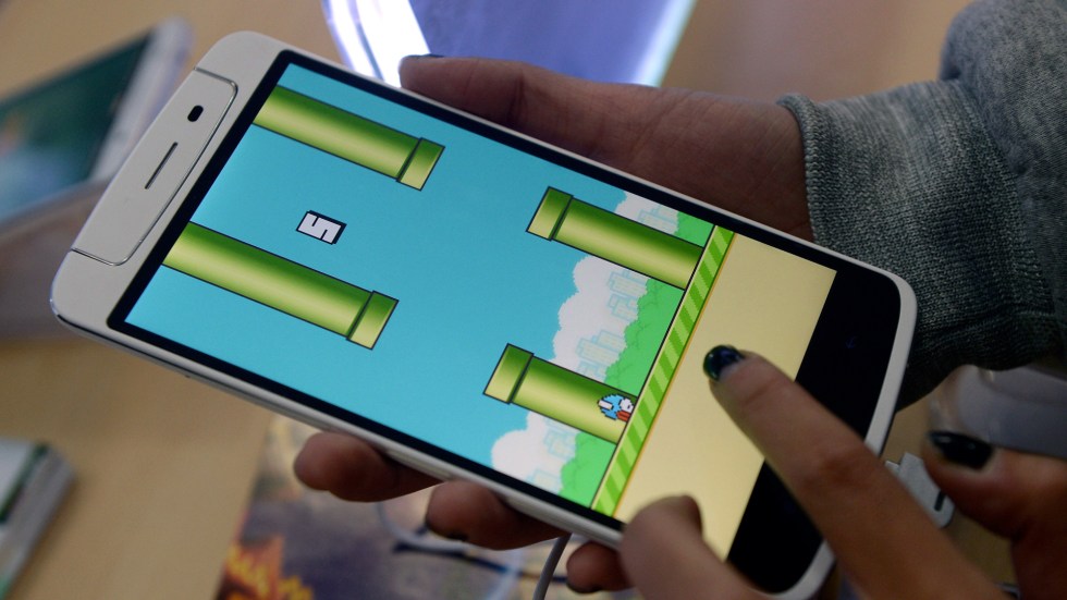 The iconic mobile game, "Flappy Bird," returning to app stores, but not without controversy, with the original creator denying involvement.