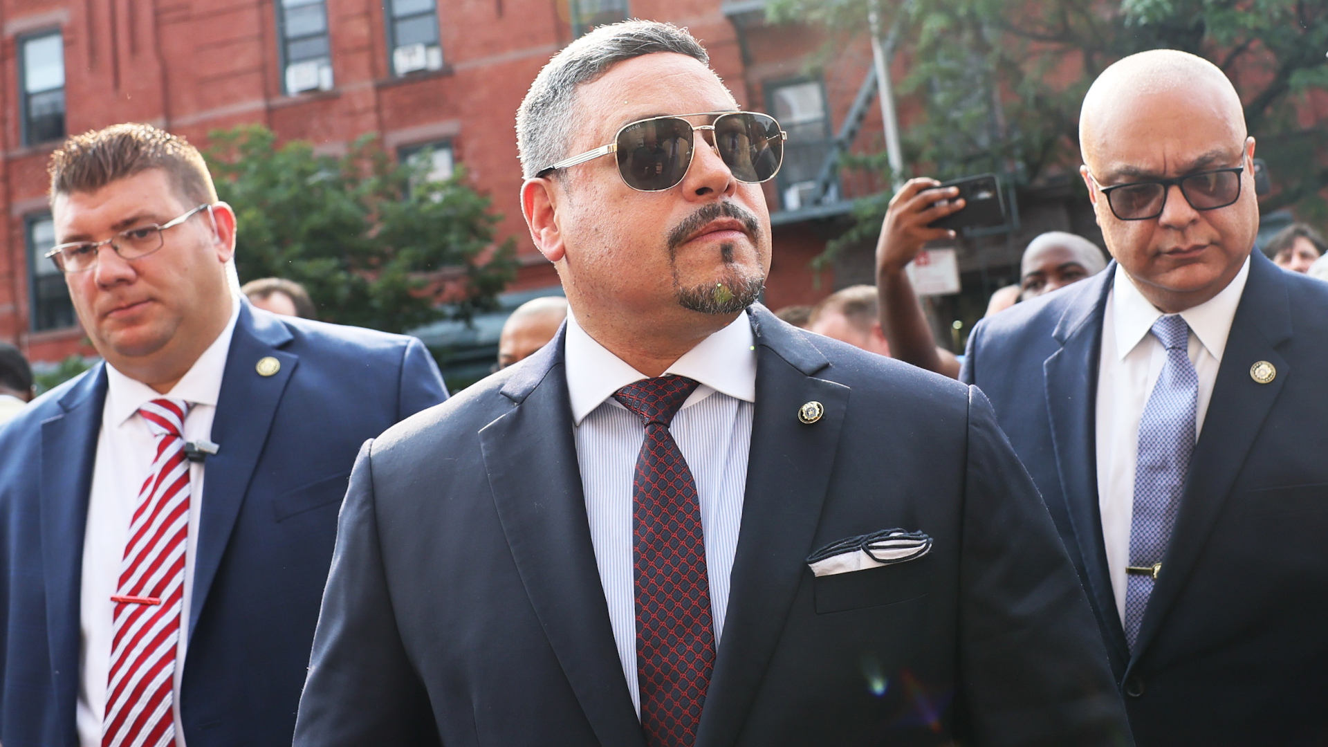 NYPD Commissioner Edward Caban faces pressure to resign after FBI raided his home amid allegations of corruption and influence peddling.