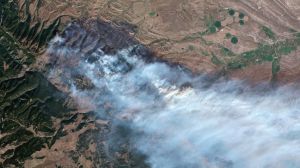 Officials say that two wildfires in Wyoming have grown to an estimated 100,000 acres.