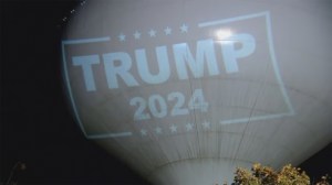 A town in Massachusetts is fining a resident $100 a day and demanding they stop projecting a Trump 2024 sign on the town's water tower each night.