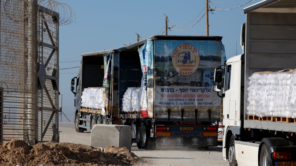 Nearly 100 aid trucks carrying food into Gaza were hijacked and looted by masked gunmen, worsening the humanitarian crisis.