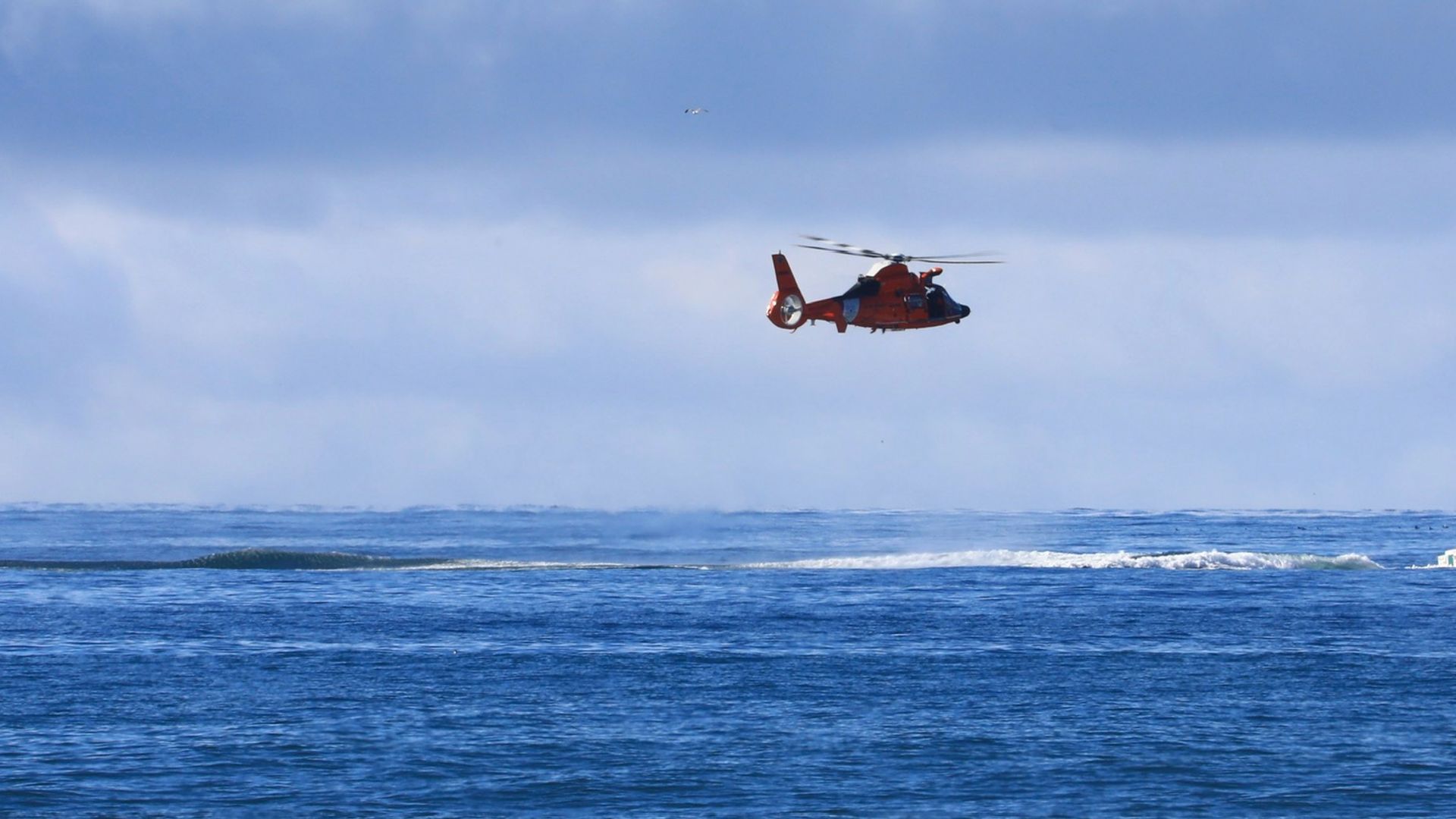 The search for five missing people has been suspended after rough seas and turbulent weather overturned a boat in Alaska on Sunday.