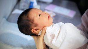 China's population fell for a third year in a row despite a rise in births, according to a report from China's National Bureau of Statistics.