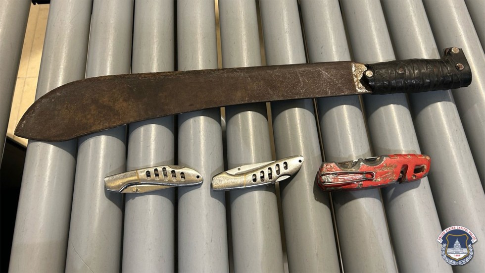 U.S. Capitol police say they arrested a man after finding a machete and three knives in his bag while he tried to enter the Capitol Wednesday.