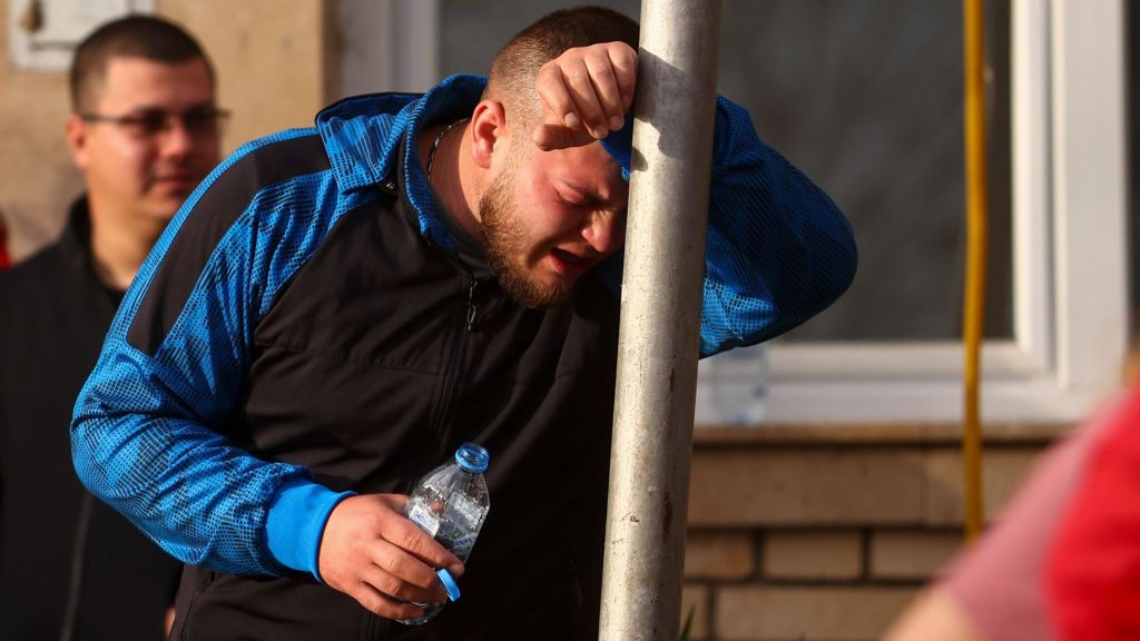 A man cries outside a hospital in the town of Kocani, North Macedonia, Sunday, March 16, 2025, following a massive fire in the nightclub early Sunday.